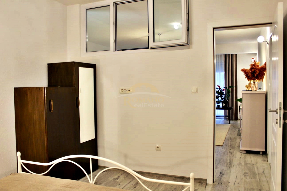 Appartamento al piano terra con terrazza e posto auto in garage